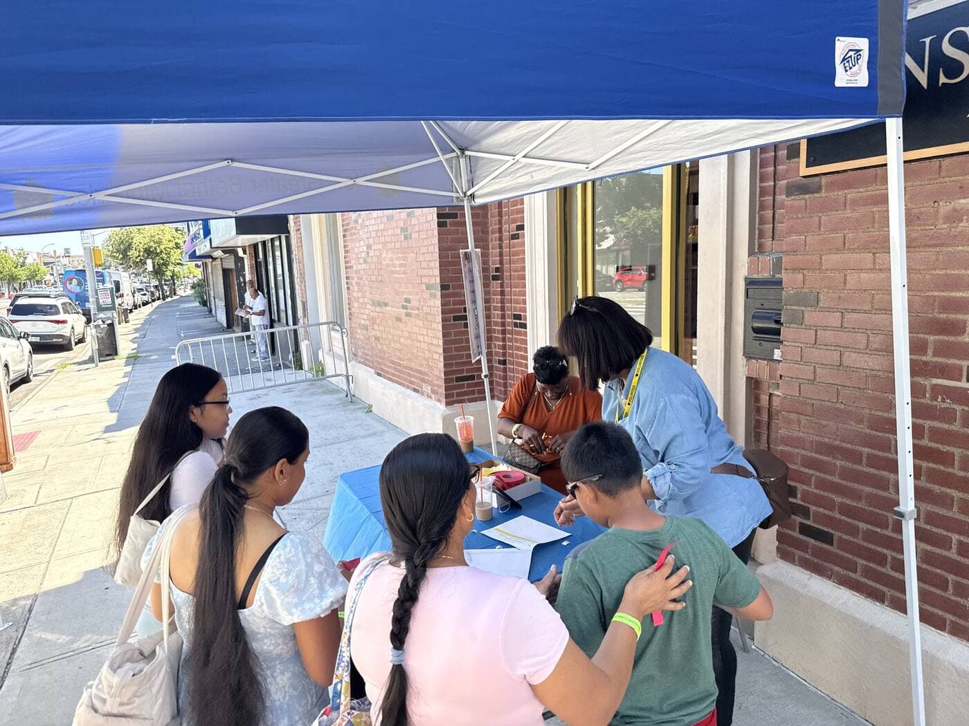 Face painting for children at an NGBM community event