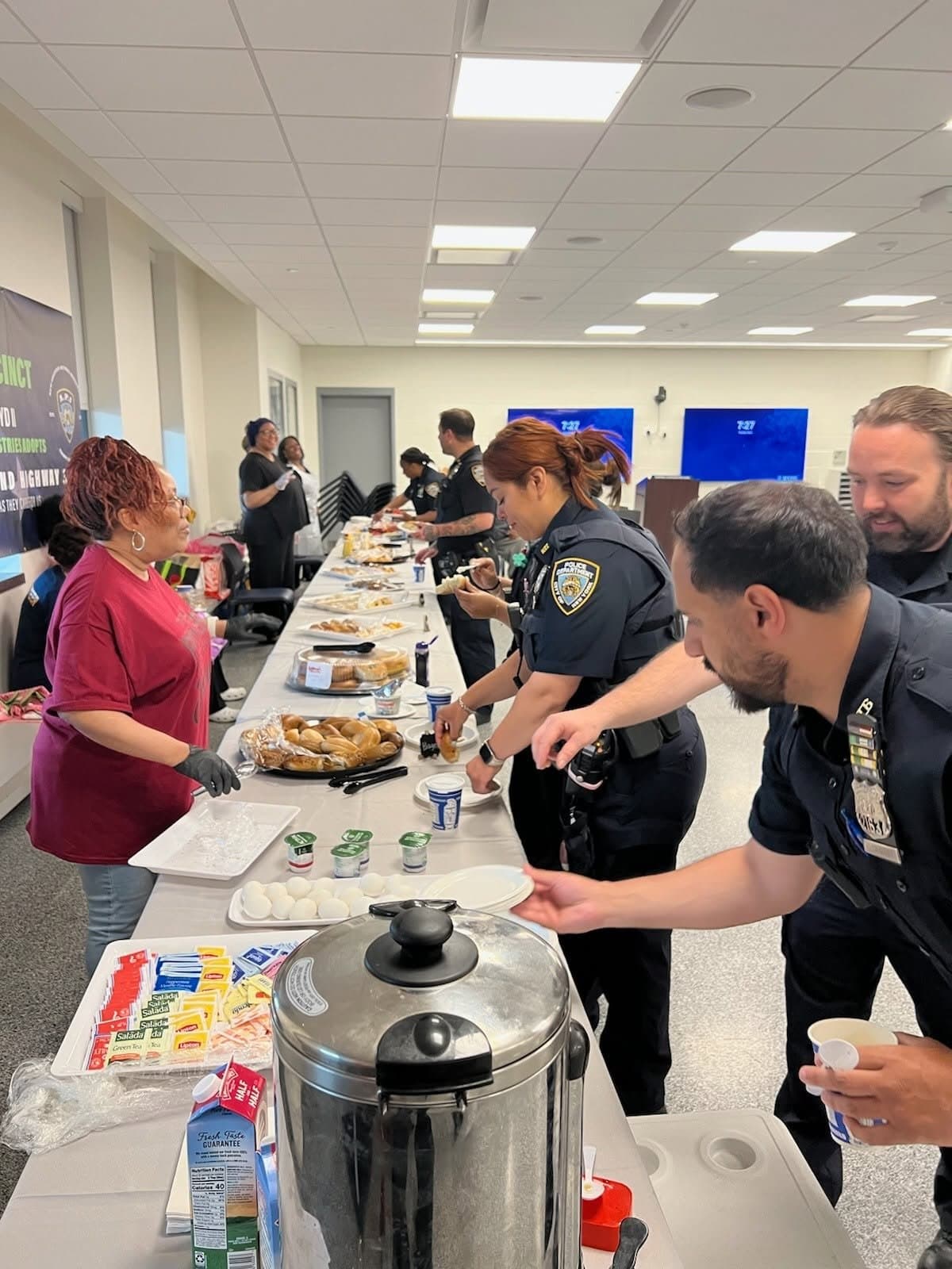 NGBM members sharing breakfast with local police