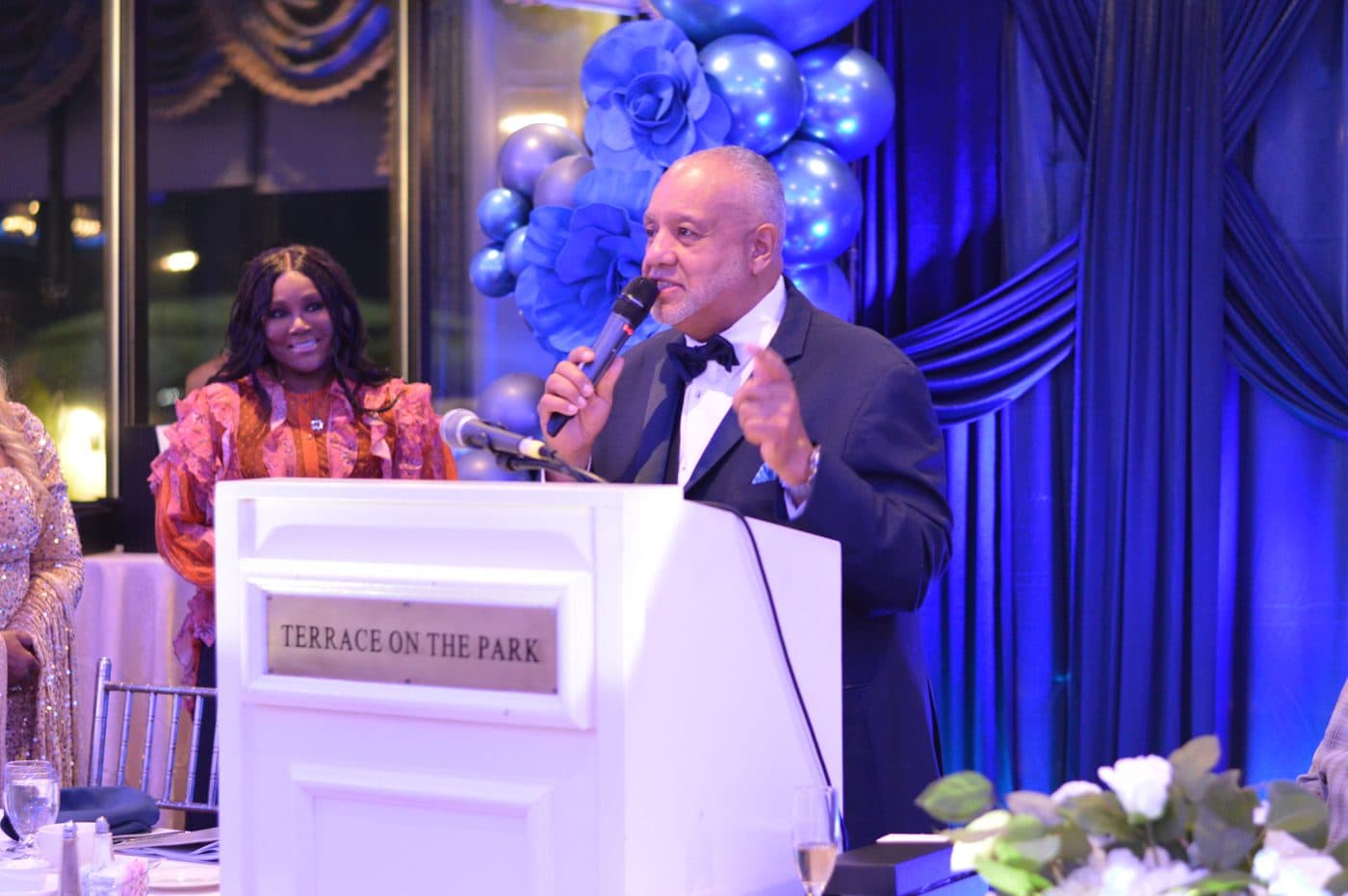 A speaker addressing guests at an NGBM banquet
