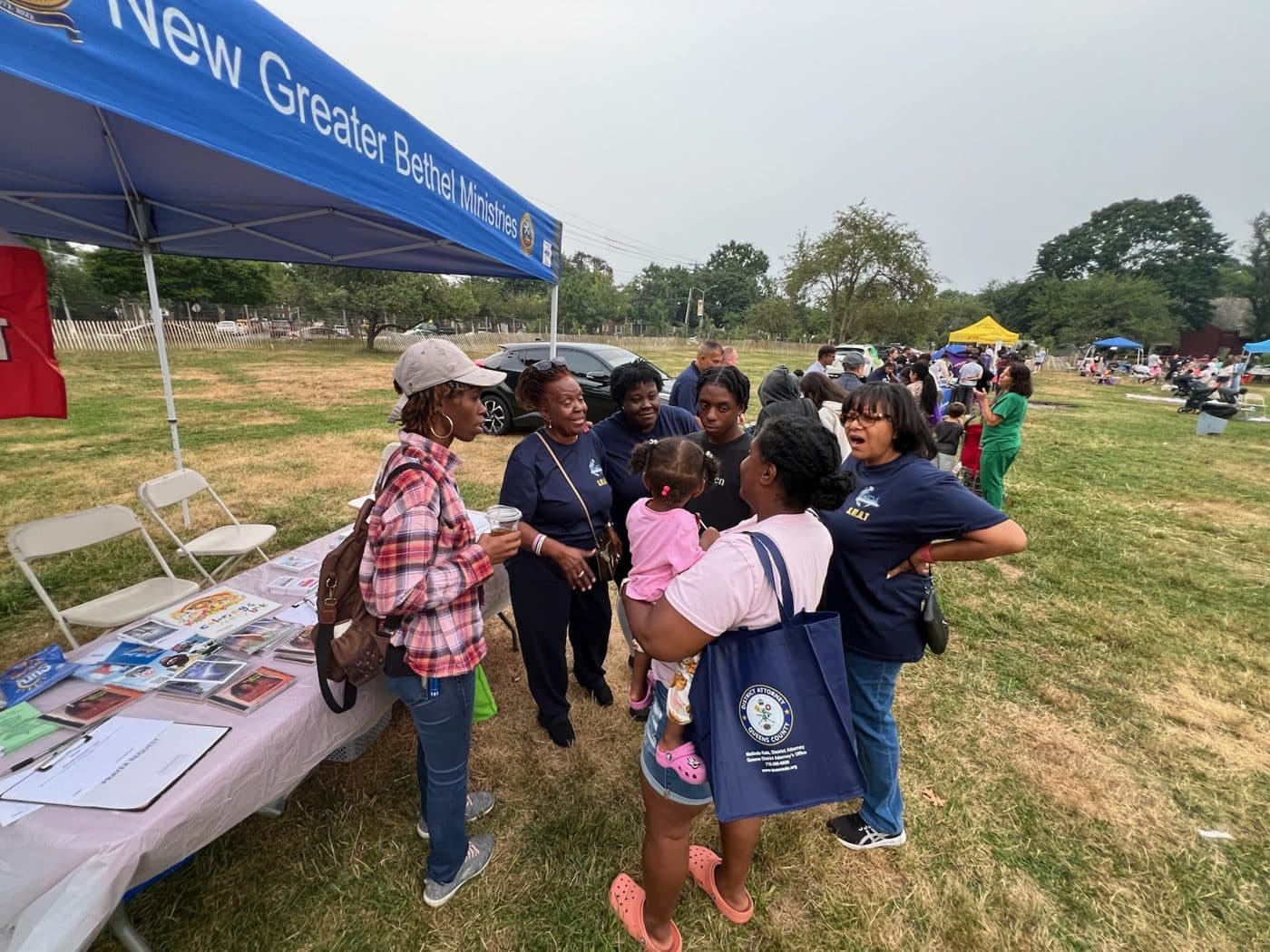 NGBM members at a community outreach table in the park