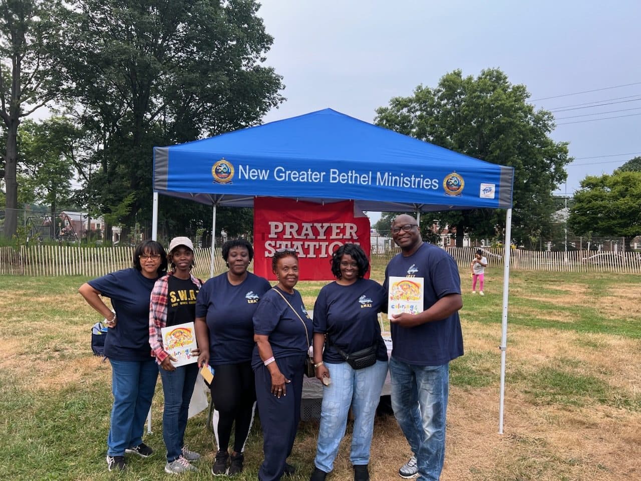 NGBM volunteers gathered at a community prayer station
